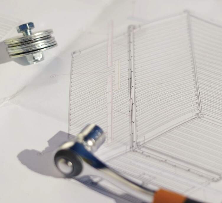 Technical drawing of a structure, with metal components in the foreground, indicating a specialization in modular data centers.